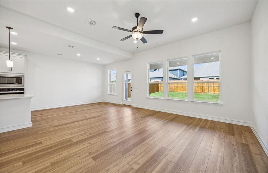 Bright gathering room with large windows  *real home pictured