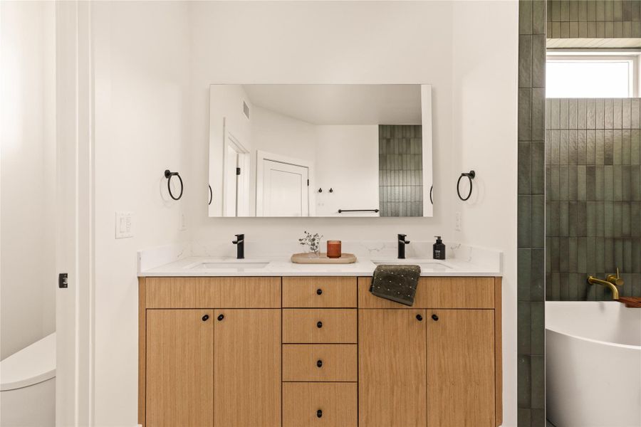 Full bath with a soaking tub and double vanity