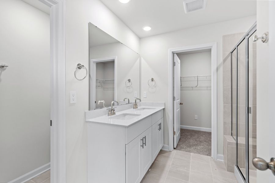 The primary ensuite boasts duel sinks, tile shower and large walk-in closet. The primary ensuite boasts duel sinks, tile shower and large walk-in closet.