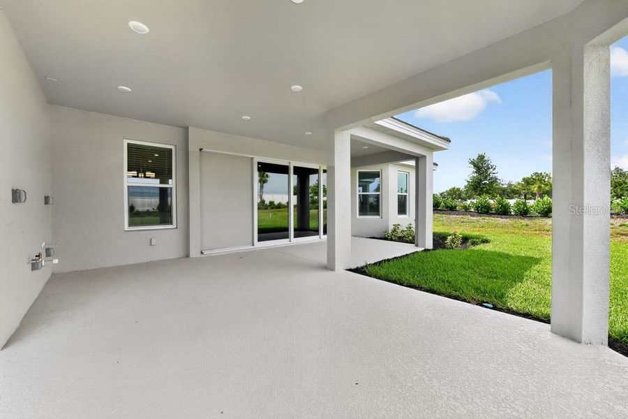 Exterior details and patio area of a home in Esplanade at Azario Lakewood Ranch, Bradenton (Image 3). Exterior details and patio area of a home in Esplanade at Azario Lakewood Ranch, Bradenton (Image 3).