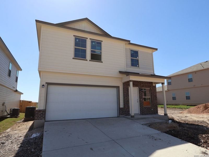 Front exterior of a new home in Paloma Park, Converse, TX, highlighting curb appeal (Image 19).