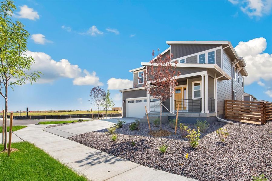 Front exterior of a new home in Legato, Commerce City, CO, highlighting curb appeal (Image 21).