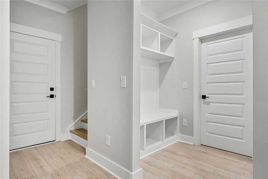 A well-lit entry hall features light-toned floorin A well-lit entry hall features light-toned floorin
