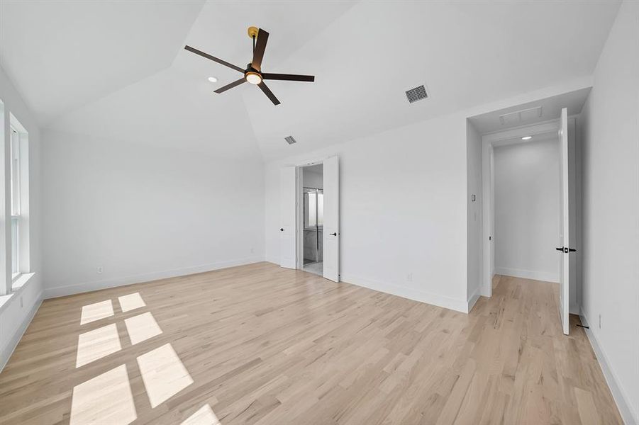 Unfurnished bedroom with light wood-style floors, a ceiling fan, high vaulted ceiling, and recessed lighting