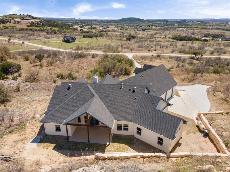 Overview of rural landscape featuring a mountainous background