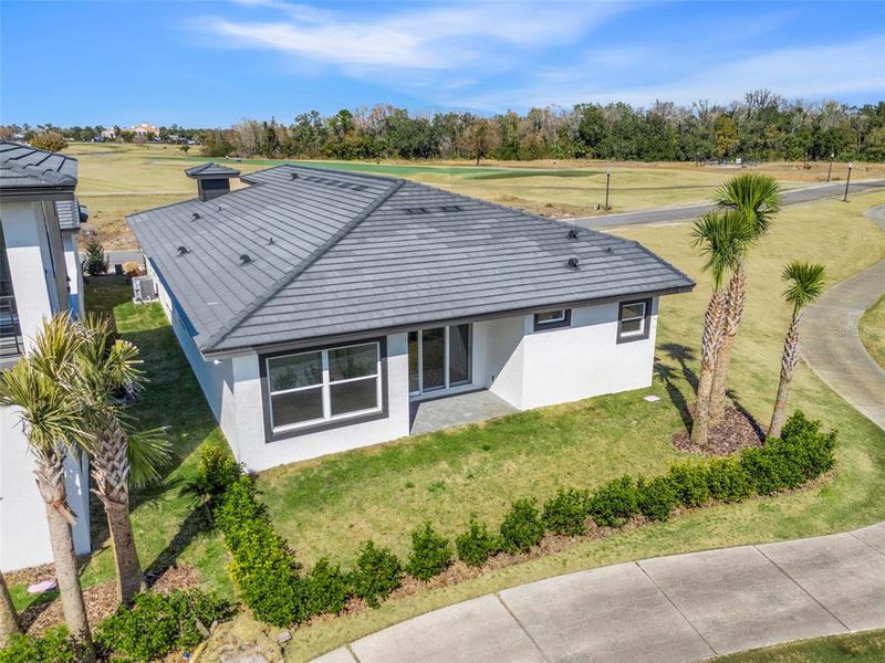 Exterior details and patio area of a home in Hampton Green at Providence, Davenport (Image 25).