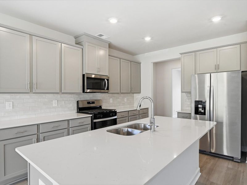 Furnished interior view inside a new home in The Farm at Wells Creek - Signature Collection, Gray Court (Image 4).