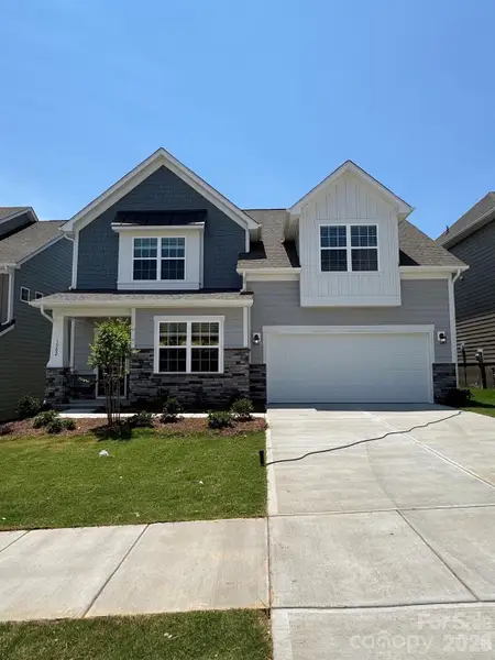 Front exterior of a new home in Redhawk, Belmont, NC, highlighting curb appeal (Image 1). Front exterior of a new home in Redhawk, Belmont, NC, highlighting curb appeal (Image 1).