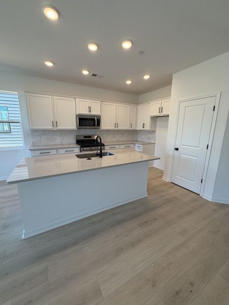 Furnished interior view inside a new home in Nexus Townhomes, Gallatin (Image 6).