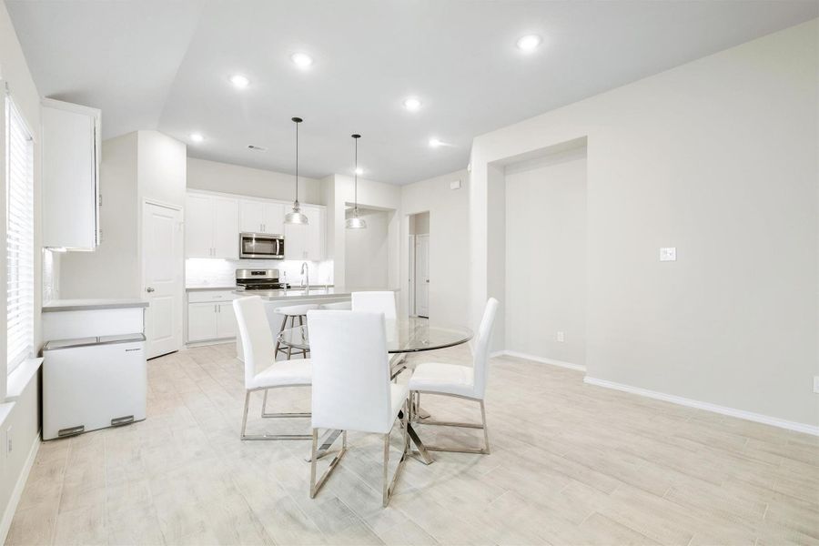 The casual dining area sits right at the heart of it all, tucked between the kitchen and the family room for that natural everyday flow. The casual dining area sits right at the heart of it all, tucked between the kitchen and the family room for that natural everyday flow.