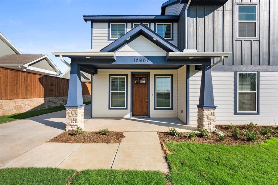 Front exterior of a new home in Heritage Towne, Grand Prairie, TX, highlighting curb appeal (Image 23).