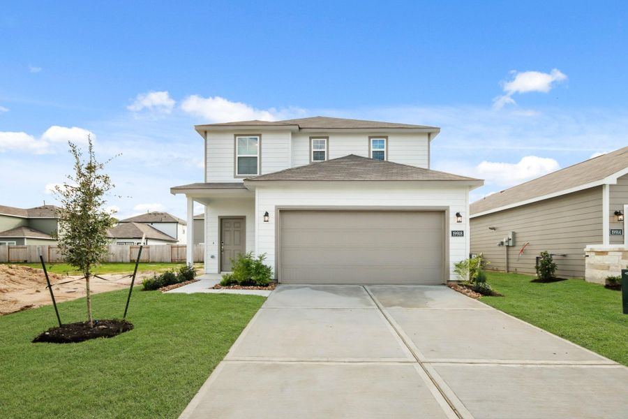 Front exterior of a new home in Northpark South, Porter, TX, highlighting curb appeal (Image 2). Front exterior of a new home in Northpark South, Porter, TX, highlighting curb appeal (Image 2).