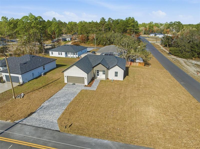 Front exterior of a new home in , Ocala, FL, highlighting curb appeal (Image 21).