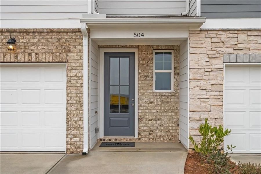 Front exterior of a new home in Stegall Village, Cartersville, GA, highlighting curb appeal (Image 18). Front exterior of a new home in Stegall Village, Cartersville, GA, highlighting curb appeal (Image 18).