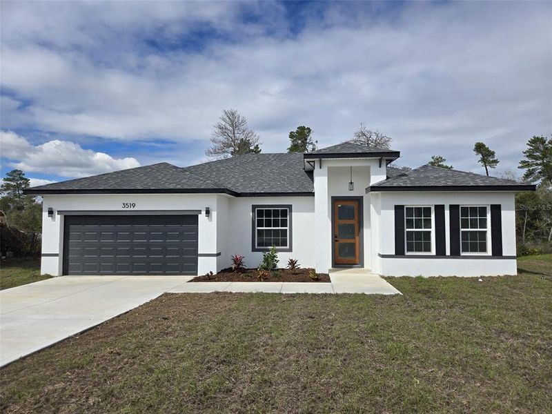 Front exterior of a new home in , Ocala, FL, highlighting curb appeal (Image 14).