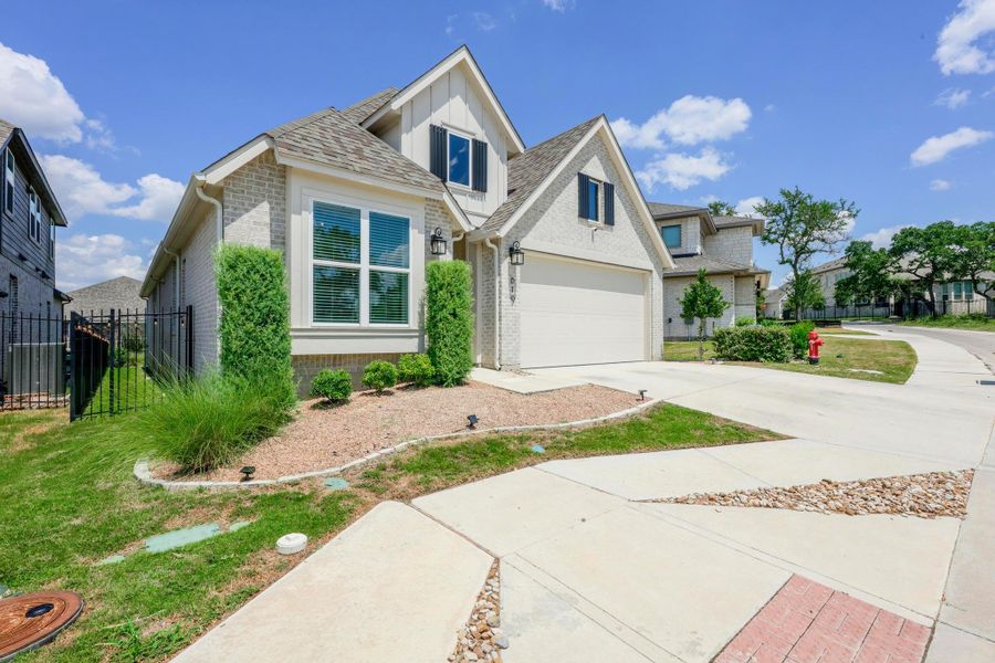 Front exterior of a new home in , Kyle, TX, highlighting curb appeal (Image 19).