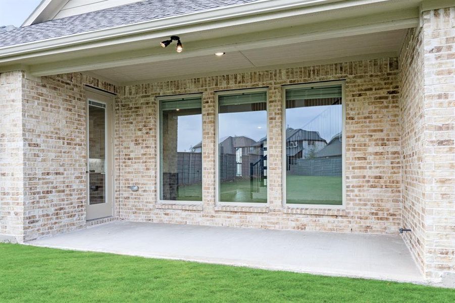 Exterior details and patio area of a home in Union Park Classic 60, Little Elm (Image 4). Exterior details and patio area of a home in Union Park Classic 60, Little Elm (Image 4).