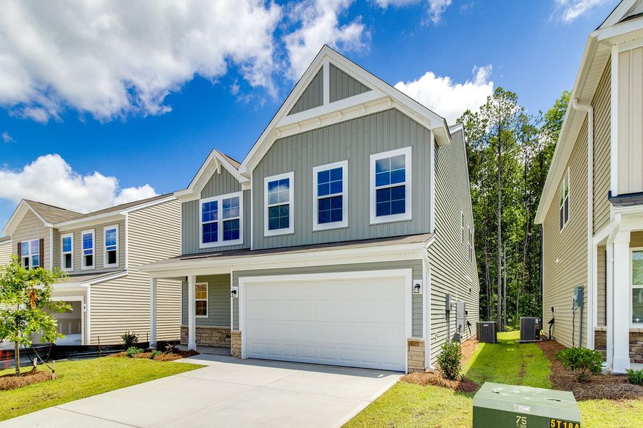 Front exterior of a new home in Ellington, Elgin, SC, highlighting curb appeal (Image 2). Front exterior of a new home in Ellington, Elgin, SC, highlighting curb appeal (Image 2).