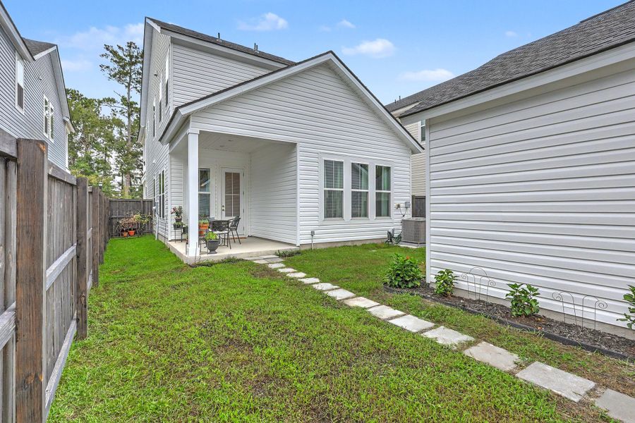 Exterior details and patio area of a home in Limehouse Village: Row Collection, Summerville (Image 32).