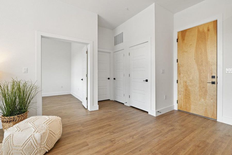 Sitting room featuring light wood-style flooring
