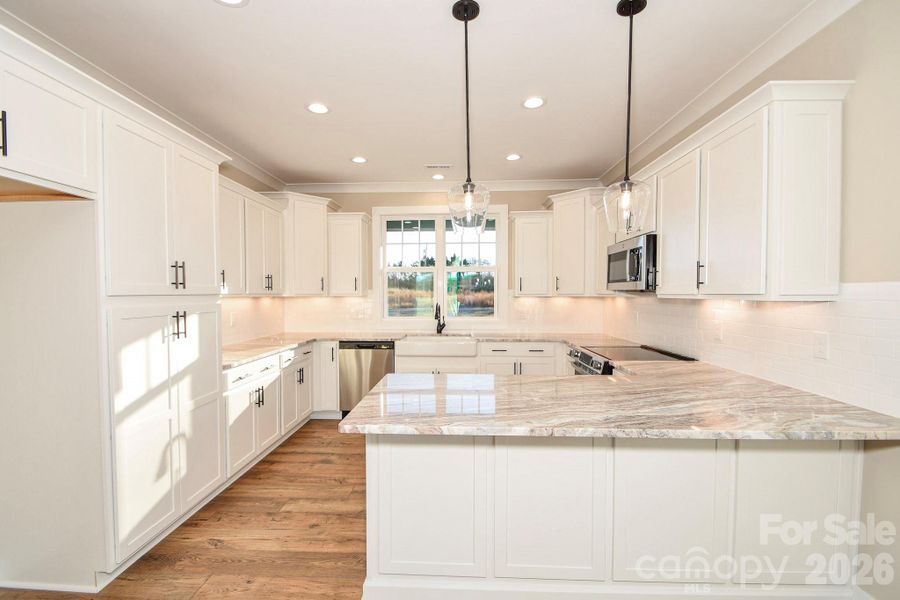Furnished interior view inside a new home in , Wingate (Image 4).