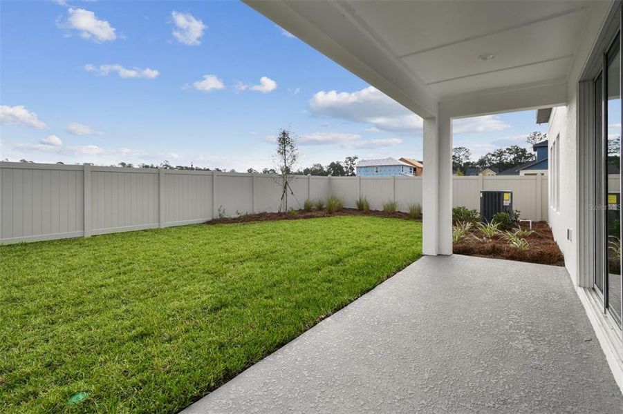 Exterior details and patio area of a home in Oakfield at Mount Dora Village Series, Mount Dora (Image 4).