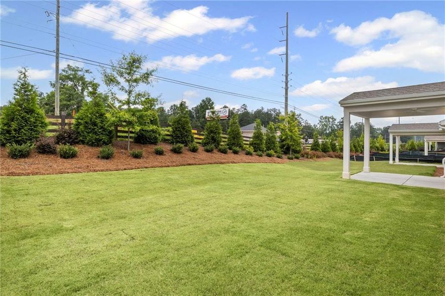 Front exterior of a new home in Laurel Farms, Dallas, GA, highlighting curb appeal (Image 24). Front exterior of a new home in Laurel Farms, Dallas, GA, highlighting curb appeal (Image 24).