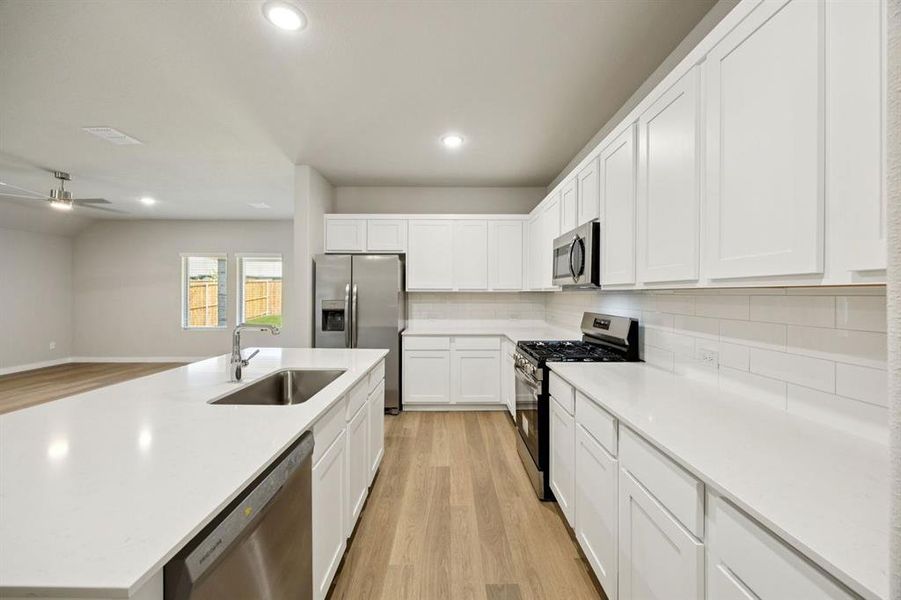 Kitchen in the Oscar home plan by Trophy Signature Homes – REPRESENTATIVE PHOTO