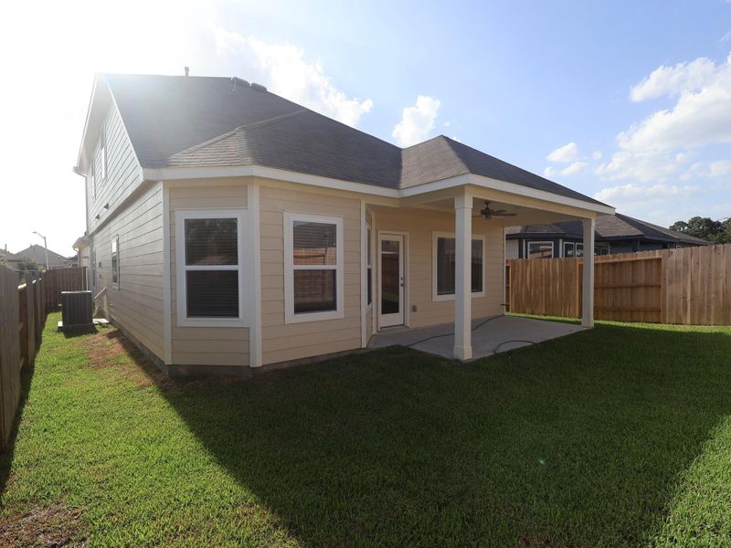 Exterior details and patio area of a home in Pinewood at Grand Texas, New Caney (Image 4).