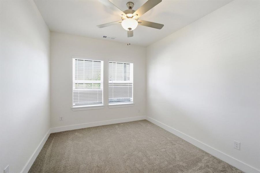 Neutral-toned carpeting paired with crisp white walls