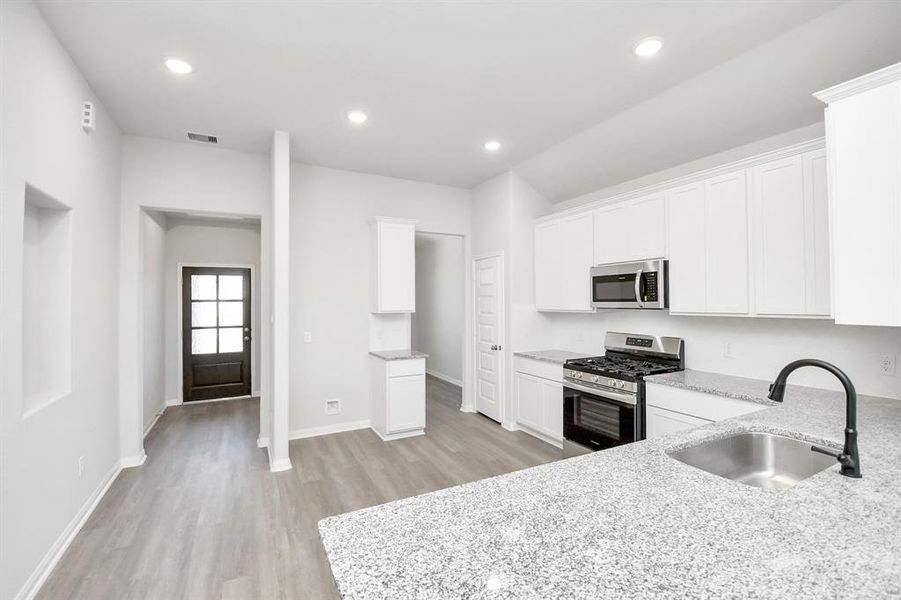 Discover another perspective of this spacious kitchen!