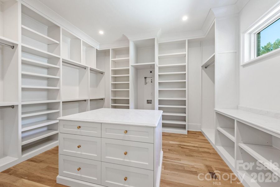 Primary closet with island and washer/dryer hookups