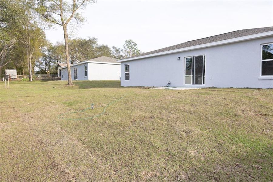 Exterior details and patio area of a home in , Citrus Springs (Image 24).