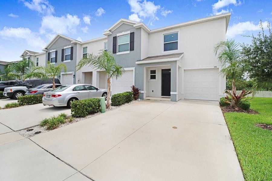 Front exterior of a new home in , Apollo Beach, FL, highlighting curb appeal (Image 21).