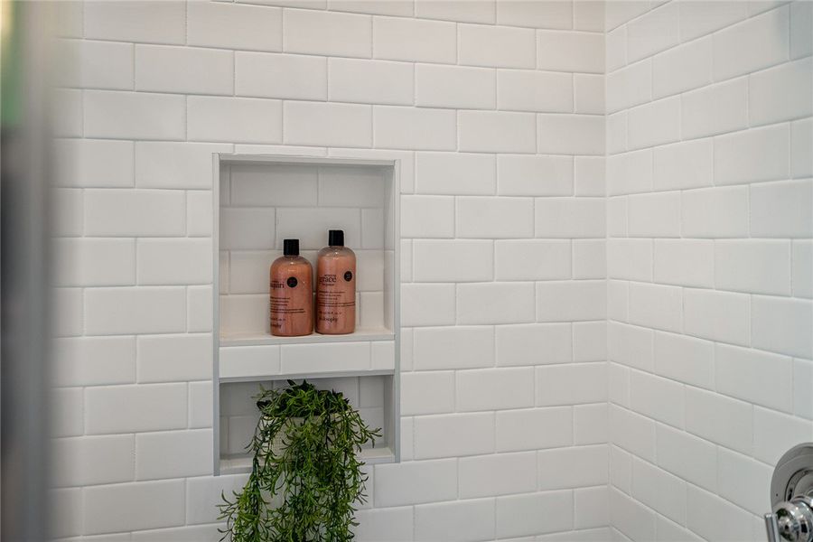 A built-in tiled niche provides practical storage A built-in tiled niche provides practical storage