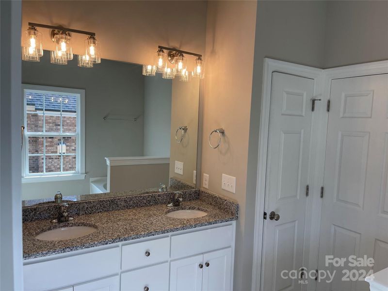 Primary Bath with ceramic tile floor