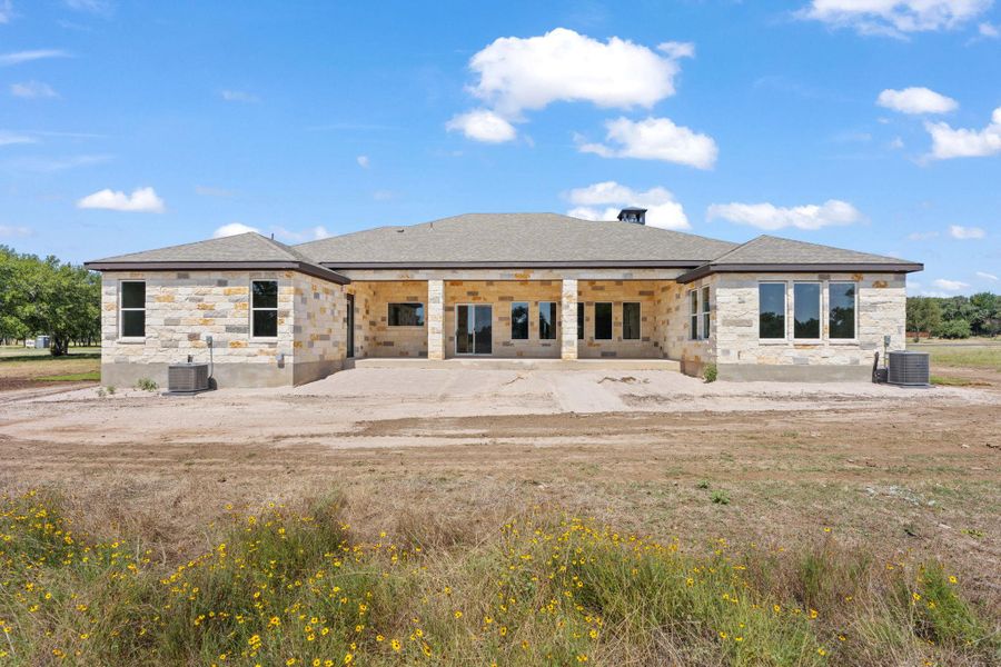 A spacious, newly constructed home with a substantial patio awaits its finishing touches. A spacious, newly constructed home with a substantial patio awaits its finishing touches.