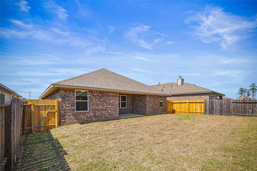 Front exterior of a new home in Grand Oaks Reserve, Cleveland, TX, highlighting curb appeal (Image 1). Front exterior of a new home in Grand Oaks Reserve, Cleveland, TX, highlighting curb appeal (Image 1).