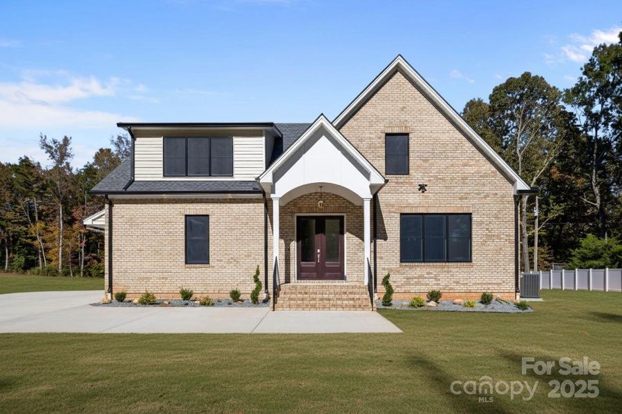 Front exterior of a new home in , Wesley Chapel, NC, highlighting curb appeal (Image 1). Front exterior of a new home in , Wesley Chapel, NC, highlighting curb appeal (Image 1).