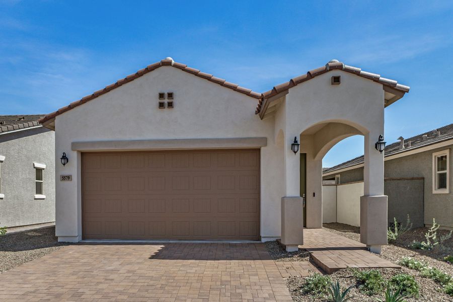 Front exterior of a new home in Mira Vista at Victory, Buckeye, AZ, highlighting curb appeal (Image 1). Front exterior of a new home in Mira Vista at Victory, Buckeye, AZ, highlighting curb appeal (Image 1).