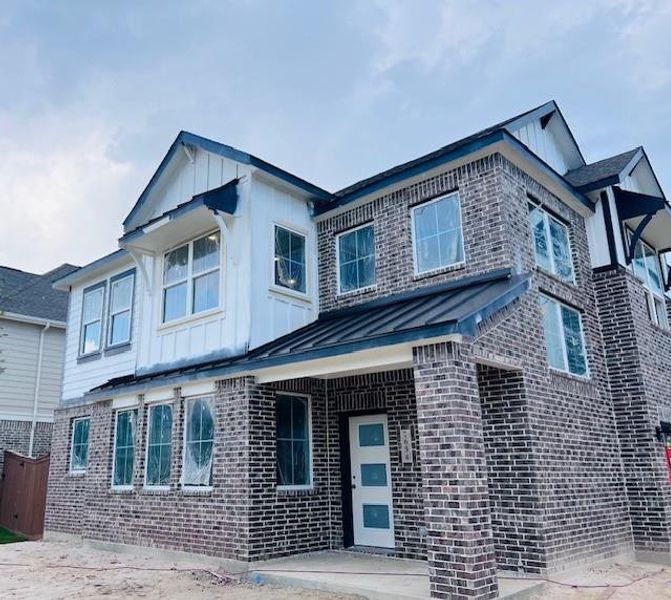 Front exterior of a new home in Elyson, Katy, TX, highlighting curb appeal (Image 3). Front exterior of a new home in Elyson, Katy, TX, highlighting curb appeal (Image 3).