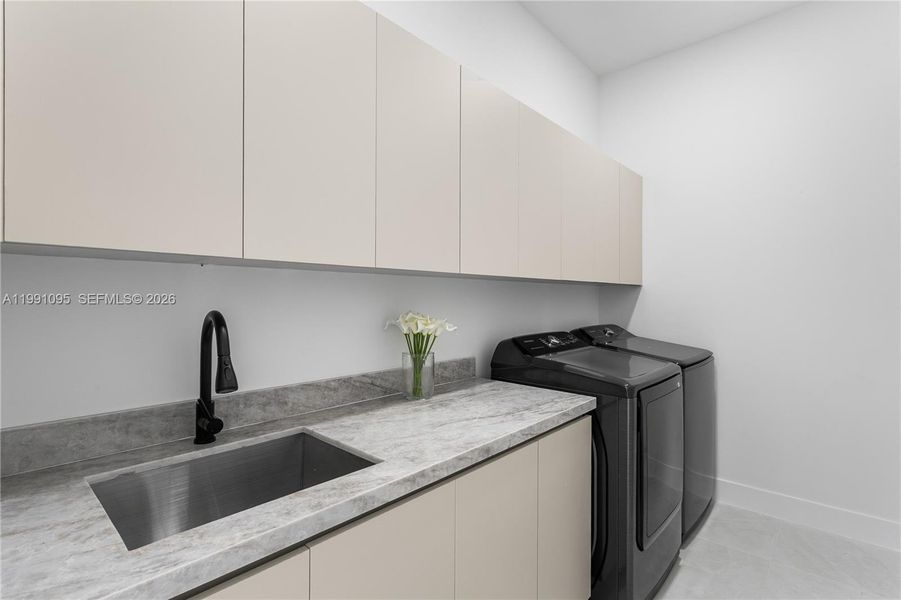 SPACIOUS LAUNDRY w/ SAMSUNG washer & dryer, built-in cabinetry, folding marble counter & utility sink SPACIOUS LAUNDRY w/ SAMSUNG washer & dryer, built-in cabinetry, folding marble counter & utility sink