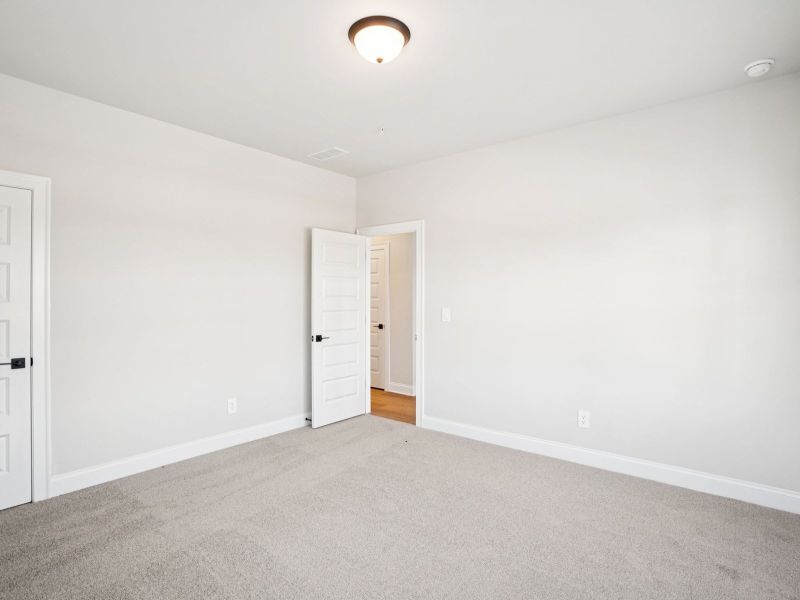 Spacious, unfurnished interior of a new home in Hemingway - Highland Series, Cumming (Image 21).