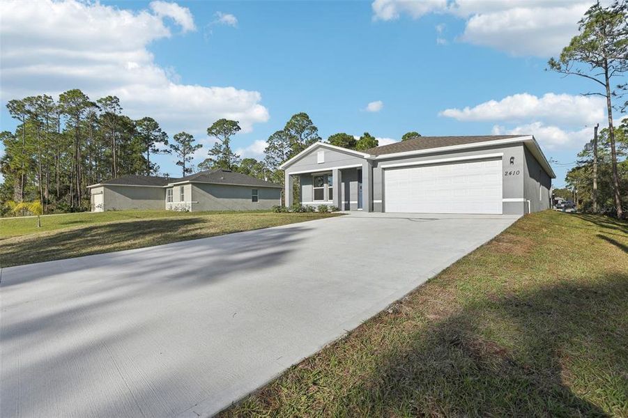 Front exterior of a new home in Sun 'N Lake, Sebring, FL, highlighting curb appeal (Image 25). Front exterior of a new home in Sun 'N Lake, Sebring, FL, highlighting curb appeal (Image 25).