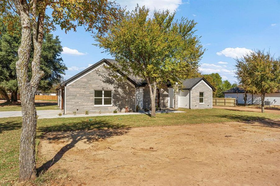 View of front of home featuring stone siding