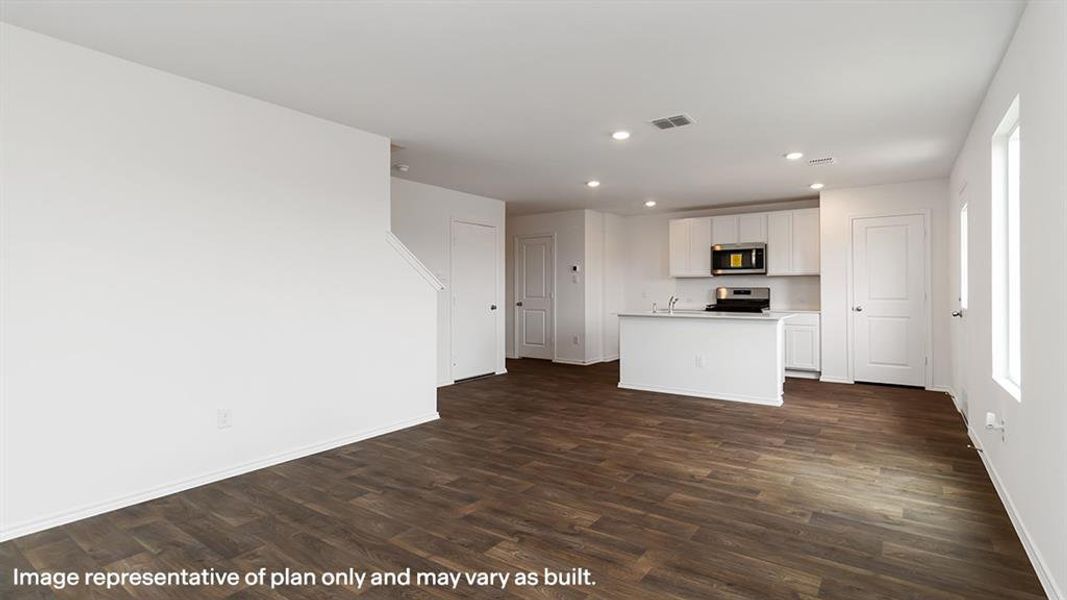 Unfurnished living room with recessed lighting and dark wood finished floors