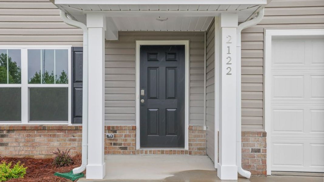 Exterior details and patio area of a home in Treemont Commons, Wellford (Image 4). Exterior details and patio area of a home in Treemont Commons, Wellford (Image 4).