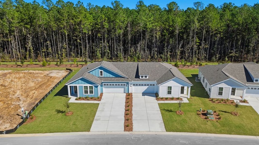 Front exterior of a new home in Sun City Hilton Head, Bluffton, SC, highlighting curb appeal (Image 20).