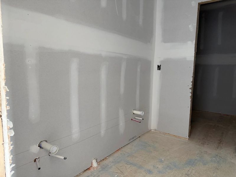 Primary Bath featuring the AW Collection® Coastal - Spa-like with white cabinets and light tile.