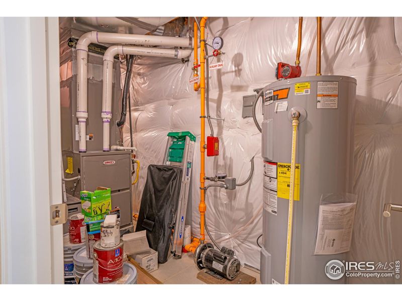 Mechanical room.  House has fire suppression system, 62 gallon water tank that is electric, as home is prewired for solar if you choose to add panels.